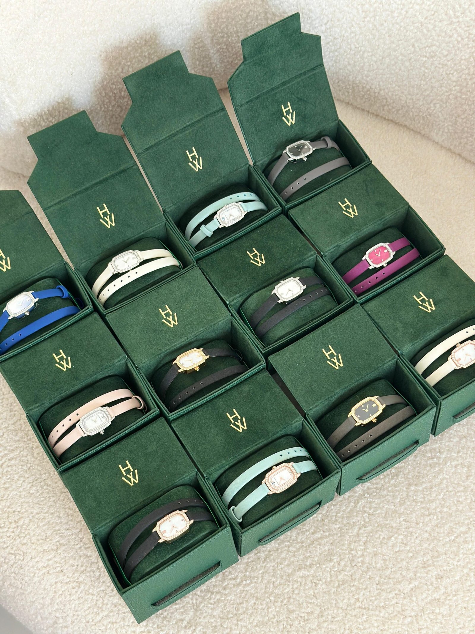 Harry Winston Emerald ladies watch in 18K white gold with diamond bezel, mother-of-pearl dial, and satin double tour strap. Harry Winston Emerald ladies watch in 18K white gold