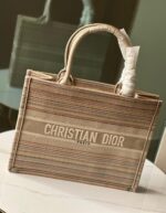 Iconic Dior Book Tote: Embroidered Canvas Masterpiece