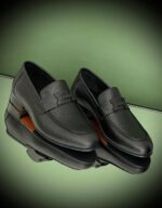 Elegant Hermès Loafers in black leather with signature metallic H buckle for UAE market