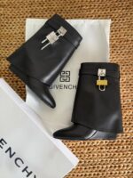 Iconic Givenchy Shark Lock Ankle Boots in black calfskin leather with fold-over shaft and signature 4G padlock