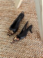 Elegant Celine Leopard Print Heels with pointed toe, black leather trim, and college-style logo detailing