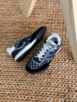 Chanel Shiny Embroidered Leather Sneakers featuring metallic finish, floral embroidery, and CC logo on the tongue