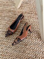 Elegant Celine Leopard Print Heels with pointed toe, black leather trim, and college-style logo detailing