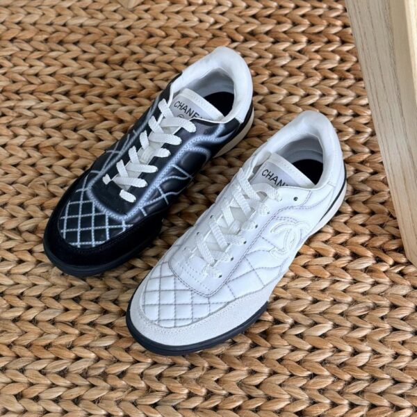 Chanel Shiny Embroidered Leather Sneakers featuring metallic finish, floral embroidery, and CC logo on the tongue