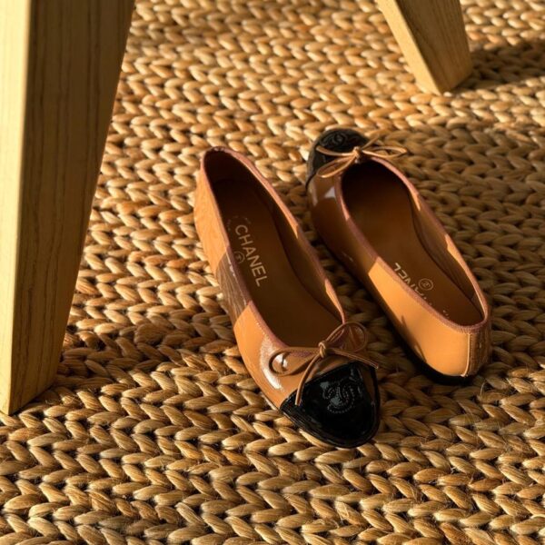 Chanel Leather Ballet Flats in black lambskin with iconic contrast cap toe and interlocking CC logo detail