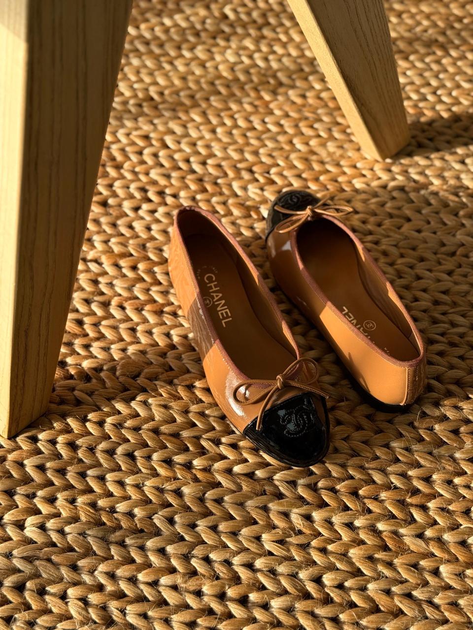 Chanel Leather Cap Toe Ballet Flats Chanel Leather Ballet Flats in black lambskin with iconic contrast cap toe and interlocking CC logo detail