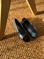 Chanel Leather Ballet Flats in black lambskin with iconic contrast cap toe and interlocking CC logo detail