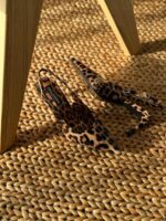 Dolce & Gabbana Kim Leopard Print Slingback Heels in polished calfskin with pointed toe and logo plaque on the stiletto heel