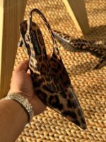 Dolce & Gabbana Kim Leopard Print Slingback Heels in polished calfskin with pointed toe and logo plaque on the stiletto heel