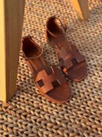 Hermès Santorini sandals with signature H-cutout and adjustable ankle strap