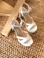 Elegant white satin wedding heels with pointed toe and stiletto heel