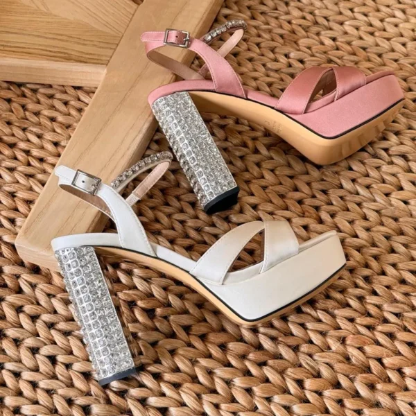 Elegant white satin wedding heels with pointed toe and stiletto heel