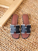 Hermès Oran leather sandals with iconic H cutout and contrast stitching