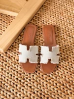 Hermès Oran leather sandals with iconic H cutout and contrast stitching