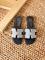 Hermès Oran leather sandals with iconic H cutout and contrast stitching