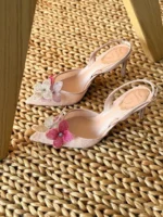 Iconic serpent-wrap strap with shimmering crystals.