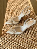 Iconic serpent-wrap strap with shimmering crystals.