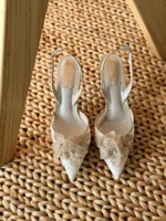 Iconic serpent-wrap strap with shimmering crystals.