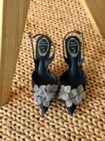 Iconic serpent-wrap strap with shimmering crystals.