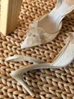 Iconic serpent-wrap strap with shimmering crystals.