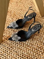 Iconic serpent-wrap strap with shimmering crystals.