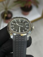 Patek Philippe Aquanaut watch with black embossed dial