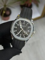 Patek Philippe Aquanaut watch with black embossed dial