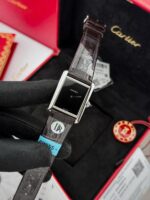 Cartier Tank Must watch with minimalist black lacquered dial and leather strap