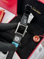 Cartier Tank Must watch with minimalist black lacquered dial and leather strap