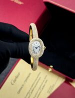 Cartier Baignoire oval watch in 18k gold with diamond-set bezel