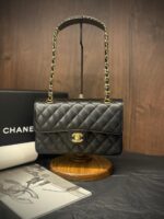 Chanel Medium Classic Flap 25cm bag in black quilted Caviar leather