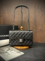 Chanel Medium Classic Flap 25cm bag in black quilted Caviar leather