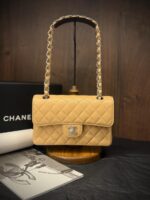 Chanel Medium Classic Flap 25cm bag in black quilted Caviar leather